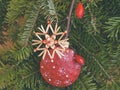 Christmas door decoration with handmande straw star and bauble